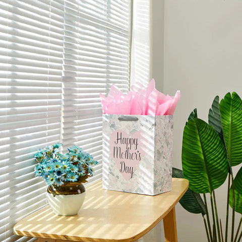 Large 13 Inch Gift Bag With Tissue Paper And Greeting Card For Mother's Day Birthdays Weddings Eco Friendly 3 Sheets Pink Tissue Included Ready To Gift In Style on table next to flowers