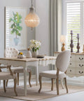 Dining room with Coastal Pineapple Table Lamp With Linen Shade and Distressed Finish, elegant furniture, natural light.