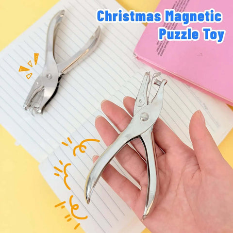 Compact Single Hole Punch Metal Circle Punch for scrapbooking and office use, handheld, placed on lined paper and pink notebook.