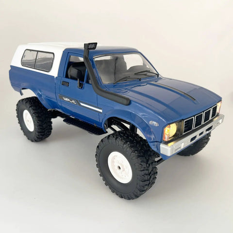 Blue All Terrain 1/16 Scale RC Rock Crawler 4x4 Ready To Run Pickup Truck With Proportional 2.4 GHz Radio LED Lights Dual Batteries