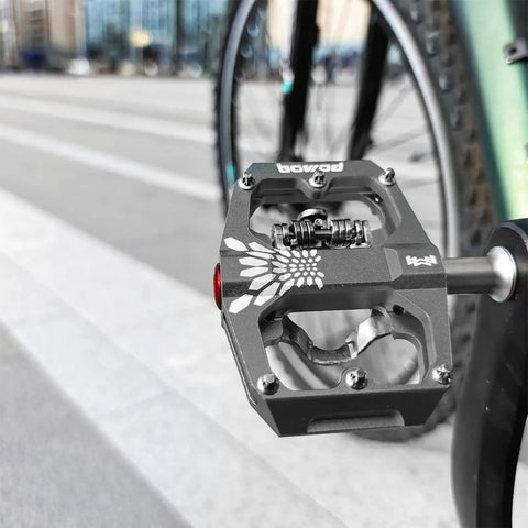 Non Slip 9 Sixteenth Inch Lightweight Nylon Fiber Bike Pedals With Wide Flat Platform installed on bicycle in urban setting