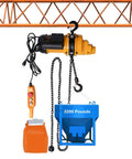 Built Tough No Sweat Electric Chain Hoist with wired remote control, 2200Lb capacity, and 10Ft lift hanging above blue container.
