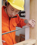 Man using 3 Pack Telescoping Measuring Stick Tap Measure Set With Long Extension Pole Reaching 94 Inches for precise measurement.