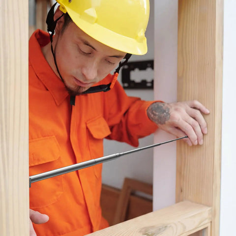 Man using 3 Pack Telescoping Measuring Stick Tap Measure Set With Long Extension Pole Reaching 94 Inches for precise measurement.