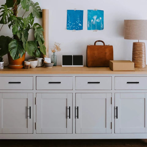 Matte Black Five Inch Cabinet Pulls Three Pack Stainless Steel Kitchen Drawer Handles on white cabinet