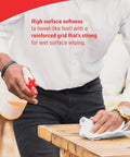 Man cleaning table with GeneralClean L30 Cloths Heavy Duty Cleaning Wipes Bulk White Wipers For Light To Medium Duty Cleanup