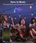 People enjoying music under Smart Outdoor String Lights 49 Ft RGBW With 15 LED Bulbs App And WiFi Control Alexa Compatible IP65 Waterproof