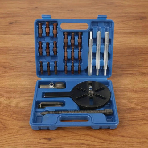 Thinking Process: bearing puller kit in blue case with metal rods, threaded screw, and puller plate