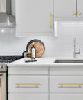 Modern kitchen with gray cabinets featuring 10 Pack 5 Inch Brushed Gold Knurled Cabinet Pulls for kitchen cabinets drawers and doors durable hardware.