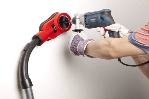 Universal Drilling Dust Shroud With Vacuum Suction For Three Eighths To Two And Five Eighths Inch Holes in use on wall