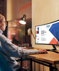 Person using a 27 Inch Curved Monitor With 1080p FHD Display, 100Hz Refresh Rate, 4ms Response, 1800R Curvature in a modern office.