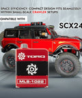 Red and black Beefy High Torque Micro Servo for 1 24 RC Crawlers in front of a red SCX24 crawler, compatible with Axial SCX24.