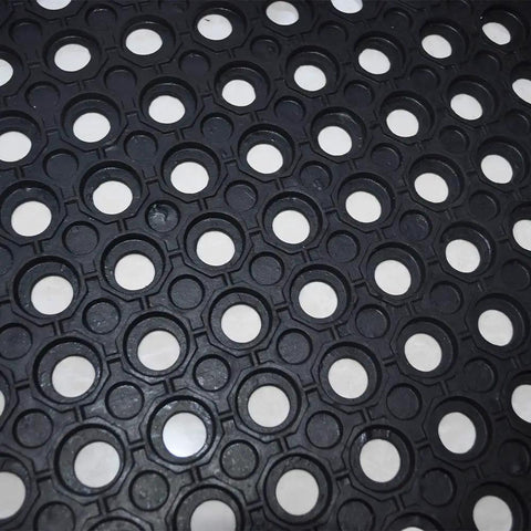 Close-up of anti fatigue rubber floor mat interlocking non slip drainage tile for restaurant kitchen bar garden outdoor wet areas