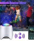 Star Projector Night Light For Bedroom With Galaxy Ocean Wave Effects, shown with Bluetooth music speaker feature.