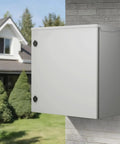 Badass Carbon Steel NEMA 4 Electrical Enclosure 24X24X12 IP65 mounted on wall in outdoor setting, dustproof and waterproof.