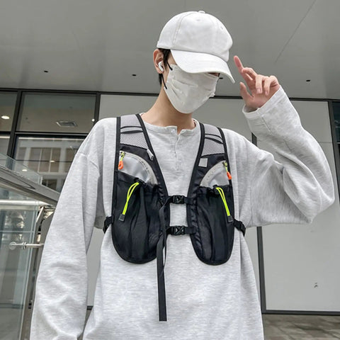 Person wearing Hydration Vest For Outdoor Adventures With Easy Access Water Bladder System Reflective Front Chest Pocket And Multiple Storage Pockets Lightweight Gear Built For Trekking Camping Cycling And Mountaineering