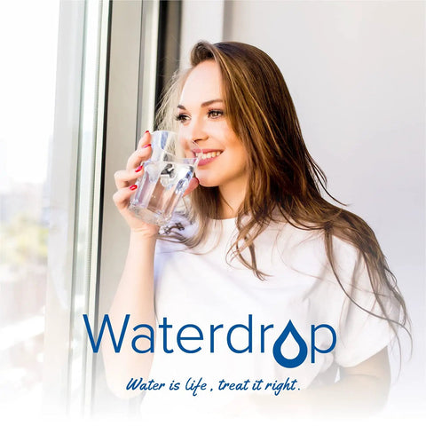 Woman drinking water at window, Waterdrop logo visible, concept of hydration and water purification.
