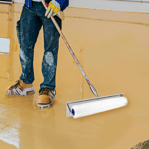 Worker using Spiked Roller For Self Leveling Concrete Floors, 20 Inch Total Length, 18 Inch Spiked Section, 21mm Needles
