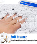 Close-up of Heavy Duty Cotton Dust Mop Head Refill with hand on soft cotton fibers, ideal for fast floor sweeping and gym maintenance.
