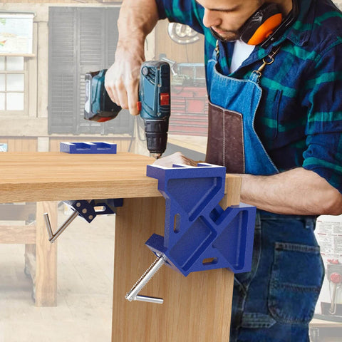 Heavy Duty Cast Iron Welder's Angle Clamp For Precise 90 Degree Joints in use, holding wood panel in workshop setting