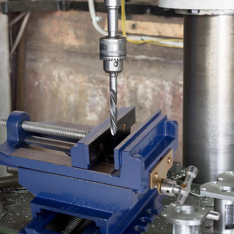 Rock Solid Cross Slide Drill Press Vise Featuring Six Inch Jaw Opening And Smooth Xy Slides For Hassle Free Benchtop Milling Woodworking And Garage Project Builds in use with drill bit.