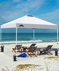 10x10 Foot Pop Up Canopy Tent With Wheeled Carry Bag set up on beach, easy one person setup, includes weight bags, white color.