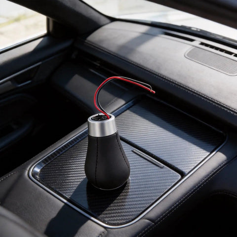 Stylish Red LED 6-Speed Gear Shift Knob For BMW E30 E36 E46 E60 E90 With Cool Glowing Light, ABS Handle For Smooth Manual Shifting And Easy Car Interior Upgrades Tonight. Black ABS shifter knob with silver top and red wires in BMW console