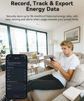 Person using Real Time Power Monitor For Your Home With 16 Channel 50A Clamp-On Sensors app in a modern living room.
