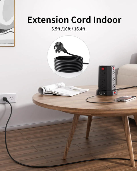 12 Outlet Surge Protector Power Strip Tower With 10 Ft Extension Cord And 4 USB Ports placed on wooden table in home office.