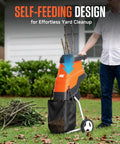 Man using Electric Wood Chipper Shredder With 15 Amp Beast Power For Branches Up To 1.8 Inches, 12 Gallon Anti Blowout Bag, 2 Extra SK5 Blades, And An 18 To 1 Mulching Ratio For Yard Waste, Compost, And Garden Beds in garden