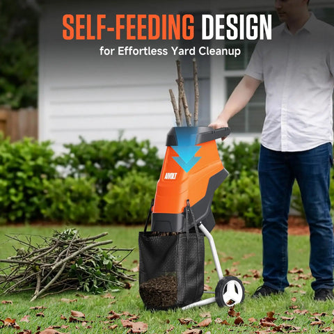 Man using Electric Wood Chipper Shredder With 15 Amp Beast Power For Branches Up To 1.8 Inches, 12 Gallon Anti Blowout Bag, 2 Extra SK5 Blades, And An 18 To 1 Mulching Ratio For Yard Waste, Compost, And Garden Beds in garden