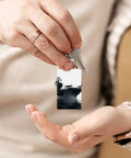 Person holding Aircraft Carrier Acrylic Keychain Transparent and Durable Key Ring Charm for Vinyl Kits and Pendants