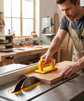 A man using a Built Tough Woodshop Push Handle Safety Guide Block With Reinforced Frame And Grippy Bottom on a table saw.