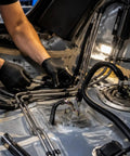 Top Tier 6AN Fuel Line Kit With 20 Ft Nylon Braided Hose And Heavy Duty Aluminum Fittings Plus Clamps For Universal Gas And Diesel Transfer Across Most Cars Without Leaks Or Drips To Keep Your Ride Runnin Smooth., mechanic installing braided fuel lines with aluminum fittings in car fuel system