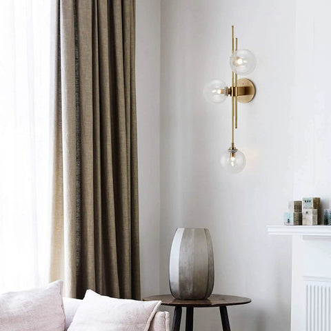 Three Light Modern Wall Sconce With Clear Glass Globe And Gold Base For Bedside Or Living Room Sleek Gold Wall Lamp