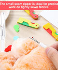 Using small seam ripper on tightly sewn fabric, colorful 10 Pack Automatic Needle Threader Set Easy No Fuss Needle Threading Tool visible.