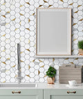 Hexagon Peel And Stick Tile Backsplash Kit With White Marble Look And Gold Metal Accents installed in kitchen setting