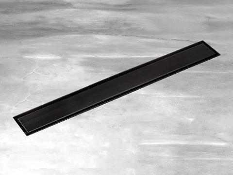 36 Inch Stainless Steel Linear Shower Drain With Tile Insert Tray And Flat Cover in matte black finish on stone surface