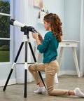 Totally Kid Friendly Space Explorer Telescope With Two Point Four Inch Video Screen And 110x Zoom Moon Viewing And Adventure Game Digital Telescope For Learning And Outdoor Stargazing on tripod with child indoors