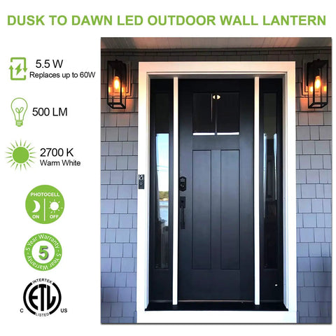 Front view of 18 Inch Outdoor Wall Light With Dusk To Dawn Sensor, Black Waterproof Lantern Fixture on a porch with a black door.