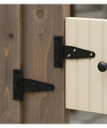 Heavy Duty Black Iron T Shaped Hinges Galvanized Rust Resistant Barn Door Hardware on wood and cream door.