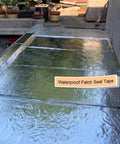Heavy Duty Self Sealing Asphalt Tape With Aluminum Foil Backing Waterproof Bitumen Roll applied on a flat roof surface.