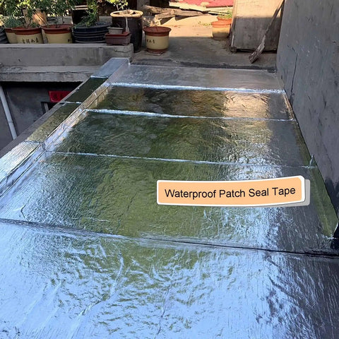 Heavy Duty Self Sealing Asphalt Tape With Aluminum Foil Backing Waterproof Bitumen Roll applied on a flat roof surface.
