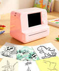 Totally Rad Pink Mini Thermal Printer With AI Voice Recognition And Built In Display Convert Speech To Line Art Instantly on a table with sketches.