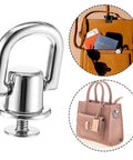 Close-up of silver D-ring from 4 Pack D Rings For Purses And Bags, showing attached handbag and open bag with accessories.