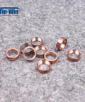 Copper valve seal rings for waterjet bleed-down valve; set of small copper hoop seals, close-up view