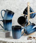 14oz Ceramic Coffee Mugs Set Of 6 With Easy Grip Handle In Ice Snow Blue Glaze With Star Blue Accents And Gold Rim displayed