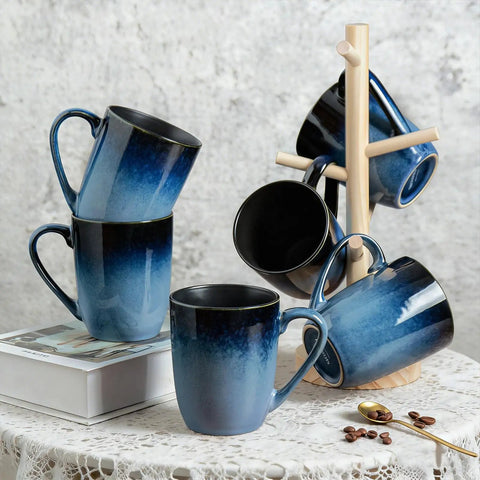 14oz Ceramic Coffee Mugs Set Of 6 With Easy Grip Handle In Ice Snow Blue Glaze With Star Blue Accents And Gold Rim displayed