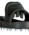 Close-up of black spiked shoes for resinous epoxy floor coatings with replaceable spikes, slip-on design for medium to XL sizes.