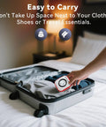 Person placing five in one CO and gas leak detector with plug in and battery backup temperature humidity sensor into suitcase